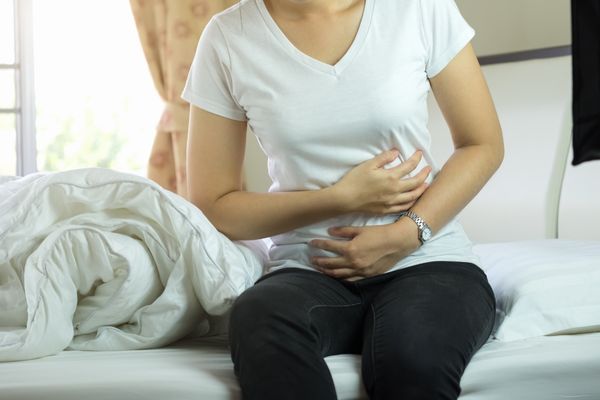 Woman suffering from painful constipation