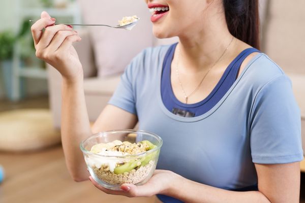 Woman enjoying meal with probiotics