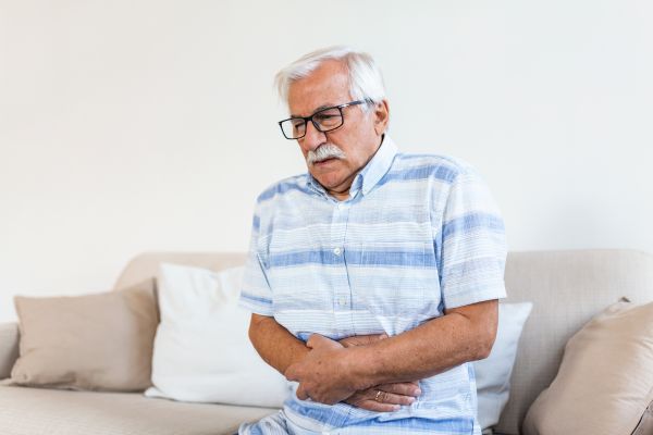 An elderly man having abdominal pain.