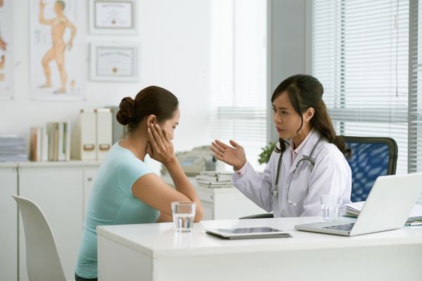 Woman consulting doctor about digestive health
